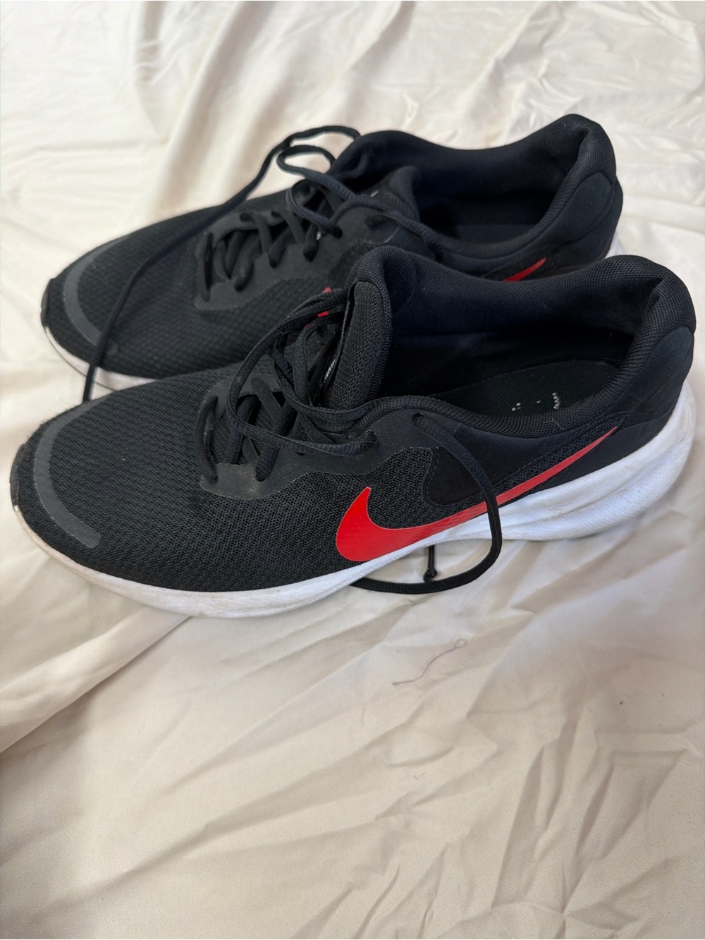 Nike Men’s Black Running Shoes with Red Swoosh and White Midsole